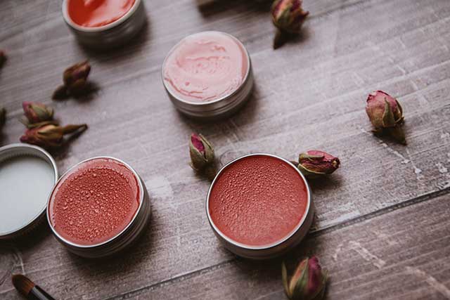 Tinted organic lip balms add a splash of color to your look.