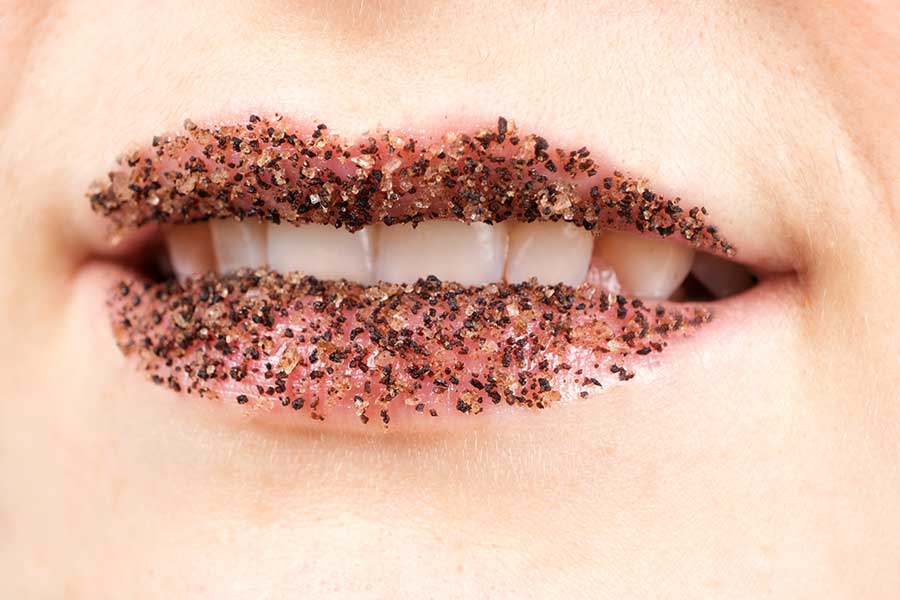 Women's lips with coffee salt scrub
